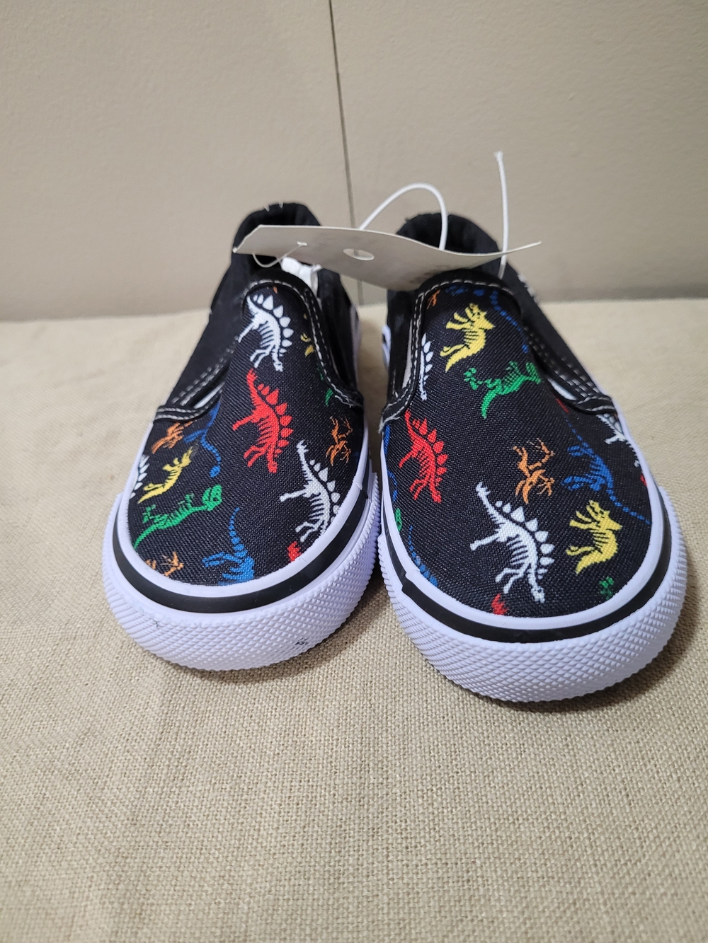 Tommy Bahama Kids Black Slip-On Sneakers with Multicolor Dinosaur Print